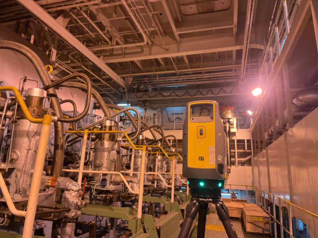 Engine room 3D laser scanning survey: laser scanner set up on board a vessel at a Vietnamese port