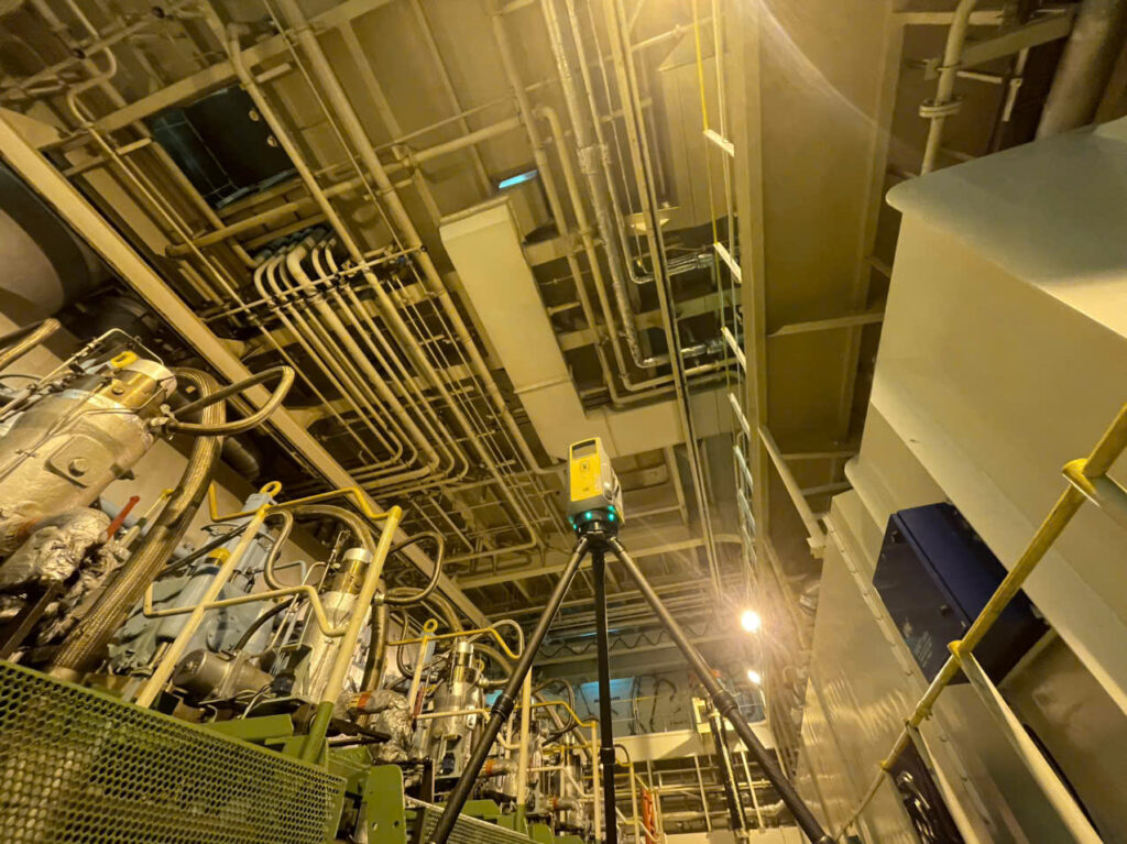 Engine room 3D laser scanning survey: laser scanner set up on board a vessel at a Vietnamese port