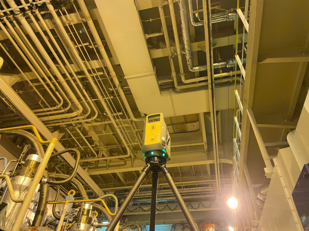 Engine room 3D laser scanning survey: laser scanner set up on board a vessel at a Vietnamese port